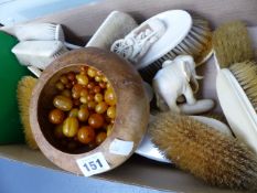 A COLLECTION OF AMBER BEADS, A CARVED WOOD FIGURE, AN IVORY ELEPHANT AND A LARGE COLLECTION OF IVORY