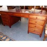 A GOOD QUALITY MAHOGANY LARGE TWIN PEDESTAL WRITING DESK WITH TOOOLED RED LEATHER INSET TOP. W.183 x