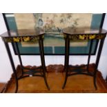 A PAIR OF REGENCY STYLE EBONISED AND GILT DECORATED OCCASIONAL TABLES.