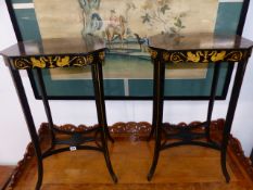A PAIR OF REGENCY STYLE EBONISED AND GILT DECORATED OCCASIONAL TABLES.