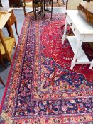 A PERSIAN TABRIZ CARPET. 390 x 305cms.