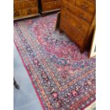 AN ANTIQUE PERSIAN CARPET OF CLASSICAL DESIGN. 335 x 230cms.