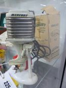 A RARE MERCURY (KIEKHAEFFER) MARK 78A MINIATURE OUTBOARD MOTOR COMPLETE WITH FUEL TANK AND