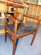 A DANISH ROSEWOOD OPEN ARMCHAIR. POSSIBLY A DESIGN BY ROBERT HERITAGE