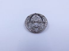 AN ART DECO PRECIOUS WHITE METAL DIAMOND AND GEMSTONE OPEN WORK BROOCH CIRCA 1920'S.