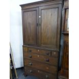 A LATE GEORGIAN MAHOGANY LINEN PRESS WITH FITTED SLIDES OVER THREE UPPER DRAWERS AND THREE FURTHER