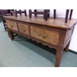A FRENCH OAK BAKER'S TABLE WITH THREE DEEP FRIEZE DRAWERS AND PULL OUT BOARD ENDS. W.171 x D.66 x