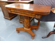 AN EARLY VICTORIAN MAHOGANY FOLD OVER TEA TABLE ON SHAPED COLUMN AND PLATFORM BASE.