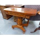 AN EARLY VICTORIAN MAHOGANY FOLD OVER TEA TABLE ON SHAPED COLUMN AND PLATFORM BASE.