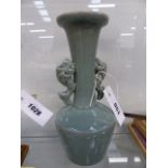 A KOREAN GREEN/GREY CRACKLE GLAZE VASE WITH STYLISED FISH FORM HANDLES.