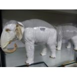 TWO CONTINENTAL PORCELAIN FIGURES OF ELEPHANTS WITH POLYCHROME DETAIL. H.21cms.