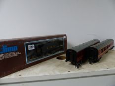 A LIMA O GAUGE BOXED LOCOMOTIVE AND TENDER TOGETHER WITH TWO CARRIAGES IN LMS LIVERY AND A SMALL