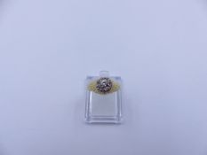 AN 18ct BARK FINISH DIAMOND SET CLUSTER RING.(FINGER SIZE O) APPROXIMATE WEIGHT 4.7grms.