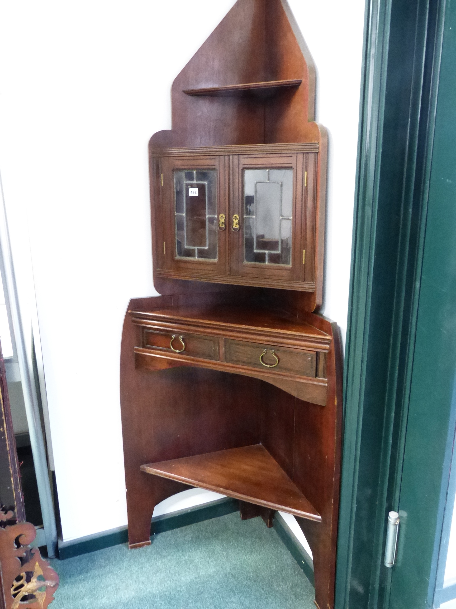 A RARE 19TH ARTS AND CRAFTS CORNER CABINET- " THE ANGLE CABINET" DESIGNED BY E.W.GODWIN AND MOST