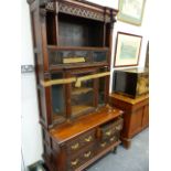 A LARGE 19th.C.OAK AND GLAZED CABINET ON A CARVED FOUR DRAWER BASE. W.112 x H.220cms.