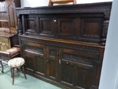 A 17th.C.AND LATER OAK COURT CUPBOARD CARVED PANEL DOORS TO BASE AND SHELVED INTERIOR. W.189 x H.