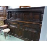 A 17th.C.AND LATER OAK COURT CUPBOARD CARVED PANEL DOORS TO BASE AND SHELVED INTERIOR. W.189 x H.