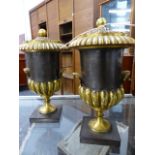 A PAIR OF EARLY 19th.C.STEEL AND ORMOLU MOUNTED LIDDED URNS WITH SHELL HANDLES, POSSIBLY RUSSIAN.