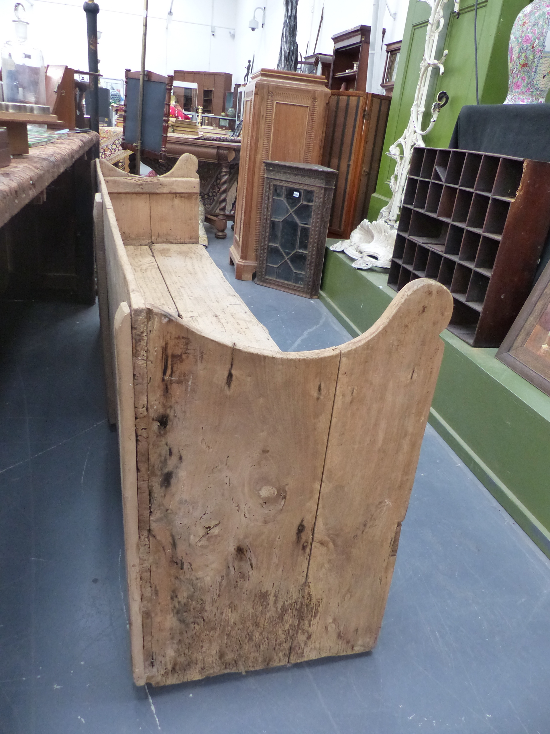 AN ANTIQUE PINE RUSTIC HALL BENCH WITH SHAPED ARMS. W.198cms. - Image 6 of 21