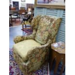 AN ANTIQUE GEORGIAN STYLE WING BACK ARMCHAIR.