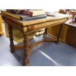 A LATE 19th.C.OAK WRITING OR CENTRE TABLE WITH CUSHION FRIEZE DRAWER, BARLEY TWIST LEGS UNITED BY