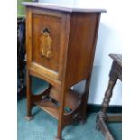 AN ARTS AND CRAFTS SMALL OAK SMOKER'S CABINET WITH BOOK TROUGH BELOW.