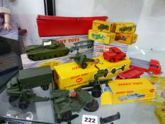 A DINKY 697 FIELD GUN SET, A 651 TANK, A 963 HEAVY TRACTOR, CARS Nos.673,674,231,233 AND 179, A