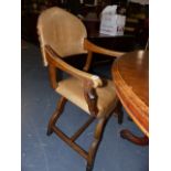 AN UNUSUAL PAIR OF LEATHER UPHOLSTERD X FRAME OPEN ARMCHAIRS.