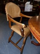 AN UNUSUAL PAIR OF LEATHER UPHOLSTERD X FRAME OPEN ARMCHAIRS.