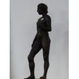 20th.C.ENGLISH SCHOOL. A STANDING MALE NUDE IN PATINATED RESIN ON WOOD BASE. OVERALL H.71cms.
