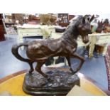 A BRONZE FIGURE OF A STALLION, A SIGNED MODERN CAST. H.51cms.