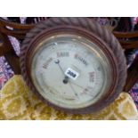 A LATE VICTORIAN ANEROID BAROMETER WITH CARVED ROPE TWIST CASE.