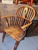 A 19th.C.ASH AND ELM WINDSOR ARMCHAIR.