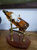 A VINTAGE WINE BOTTLE POURING CRADLE.