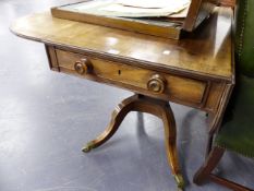 A REGNECY MAHOGANY AND ROSEWOOD CROSSBANDED PEMBROKE LIBRARY TABLE ON SHAPED SABRE LEGS, THE TOP 101