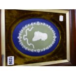 A WEDGWOOD THREE COLOUR OVAL JASPERWARE PORTRAIT PLAQUE OF JOHN WESLEY WITH IMPRESSED MARKS AND