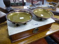 A SET OF SCALES WITH MAHOGANY INLAID BODY, MARBLE SURFACE AND TWO BRASS PANS.