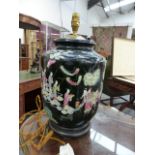 A CHINESE FAMILLE MOIRE BALUSTER FORM VASE WITH FIGURAL DECORATION MOUNTED AS A LAMP ON A CARVED