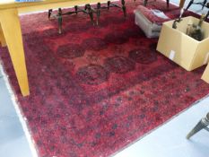 AN AFGHAN BOKHARA CARPET. 310 x 254cms.