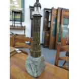 A CORNISH POLISHED STONE LIGHTHOUSE FORM TABLE LIGHTER OF UNUSUALLY LARGE SIZE. OVERALL H.58cms.