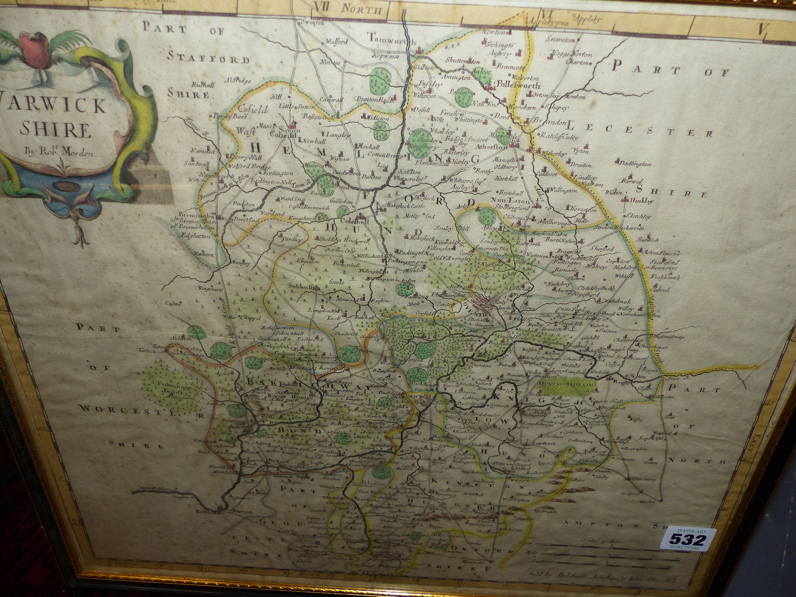 AN ANTIQUE HAND COLOURED MAP OF WARWICKSHIRE BY ROBERT MORDEN. 37 x 43cms.