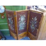 A LATE VICTORIAN SATINWOOD AND PAINT DECORATED THREE FOLD SCREEN INSET WITH PAINTED SILK PANELS. H.