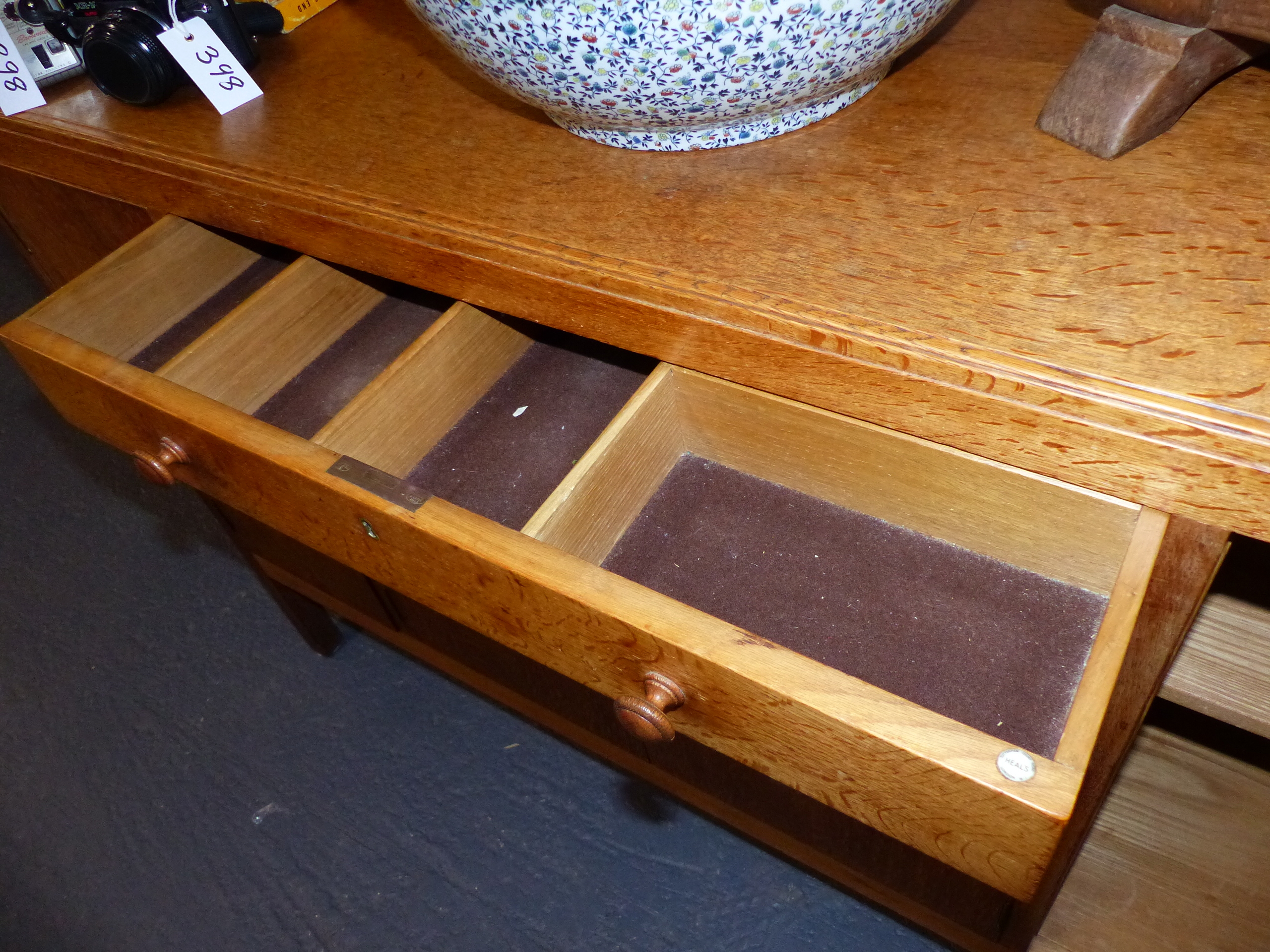 A HEAL'S GOLDEN OAK SIDEBOARD WITH TWO CENTRAL DRAWERS OVER CUPBOARD DOORS WITH TURNED WOODEN - Image 15 of 19