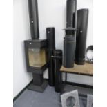 A GOOD QUALITY MODERN WOOD BURNER BY NORDPEIS COMPLETE WITH FLUE, CHIMNEY, BRACKETS AND COWLS, IN