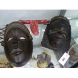 TWO ANTIQUES AFRICAN CARVED WOOD MASKS