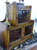 AN UNUSUAL SMALL OAK GLAZED DISPLAY CABINET.