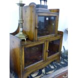 AN UNUSUAL SMALL OAK GLAZED DISPLAY CABINET.