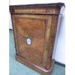 A 19th.C.BURR WALNUT AND INLAID SIDE CABINET WITH BRASS MOUNTS AND INSET PORCELAIN PLAQUE. W.83 x