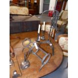 AN EARLY WROUGHT IRON ADJUSTABLE LARKSPIT, TWO RUSH NIPS, A PAIR OF CANDLESTICKS,ETC.