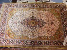 A FINELY WOVEN PERSIAN SILK RUG. 163 x 109cms.